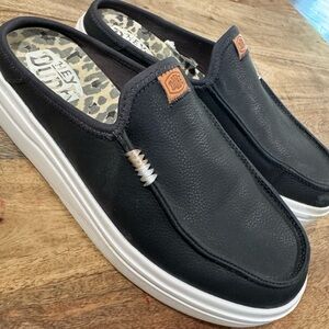 Hey Dude. Women’s Black Slip-On Loafers with White Soles